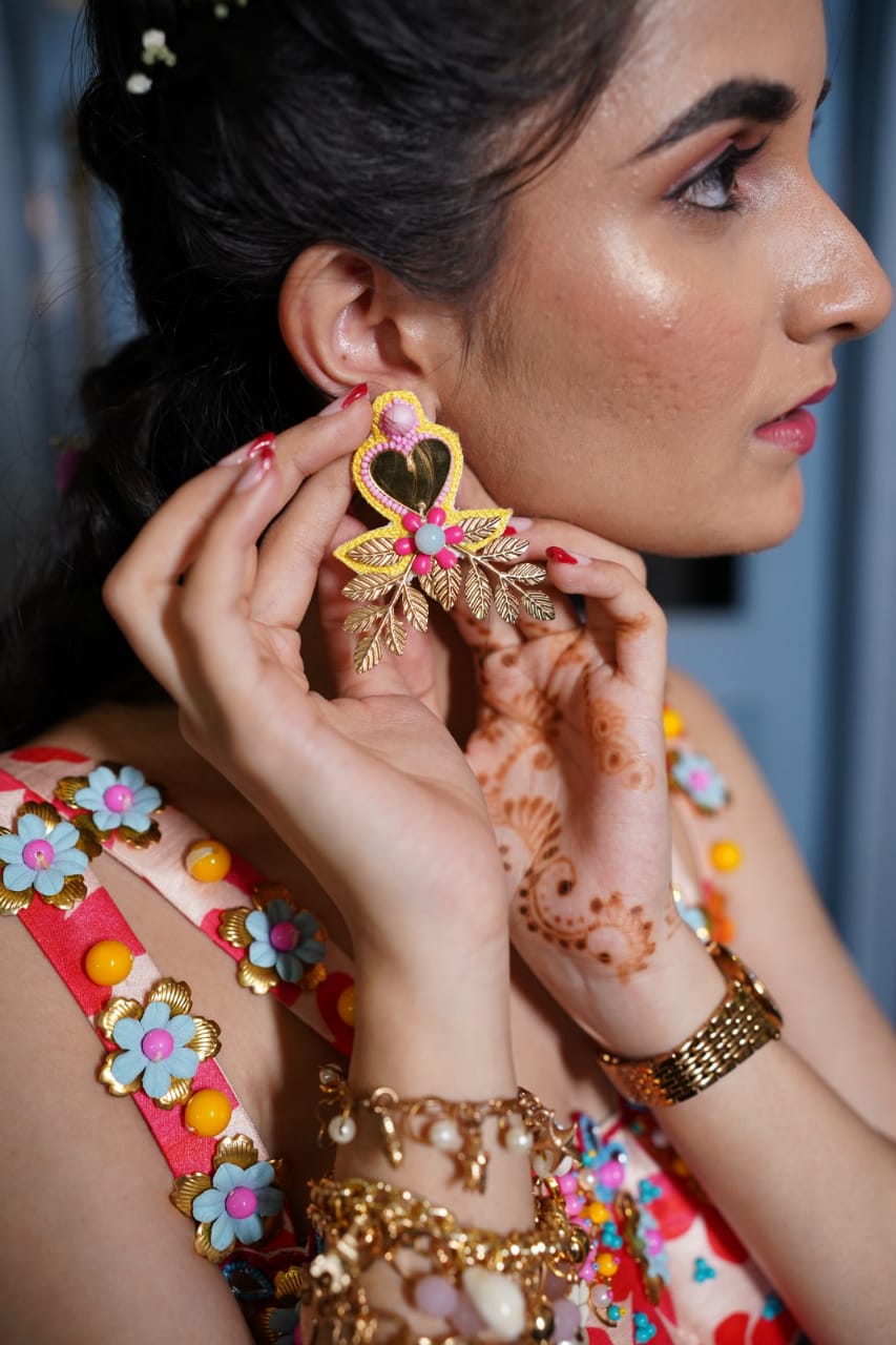 Yellow mirror beaded earrings .